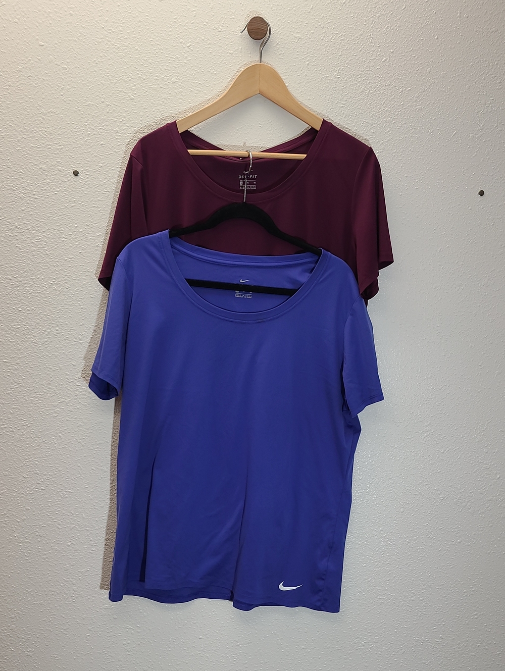 Nike Women’s Blue and Maroon Short Sleeve Scoop Neck Tees. Sold As Set